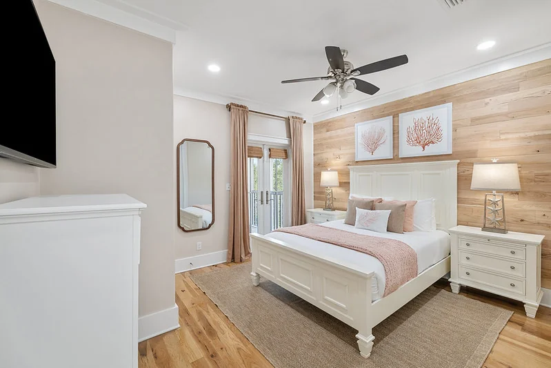 Primary bedroom with hotel-grade linens and white-glove install styling ready for guest check-in