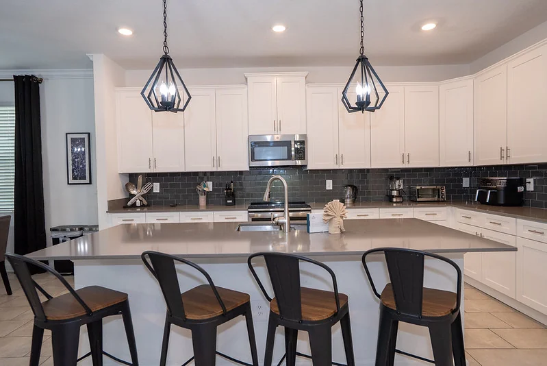 Vacation rental chef kitchen with STR interior design, durable finishes, and guest-ready layout