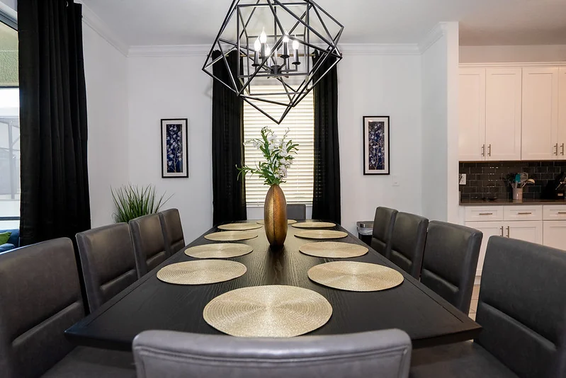 Vacation rental dining room furnished for large-group occupancy across Florida STR package tiers